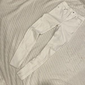 White pants with ripped knees